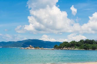Visit These 10 Sunny & Charming Beach Towns in Viet Nam - a body of water surrounded by
