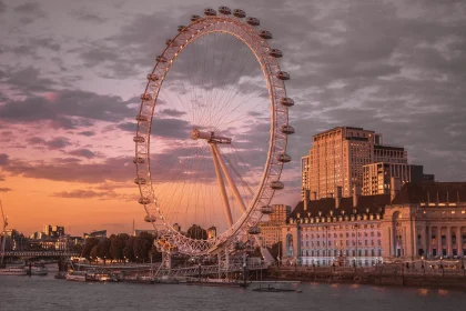 Visiting London City? Avoid these 20 Costly Mistakes - a large ferris wheel sitting in