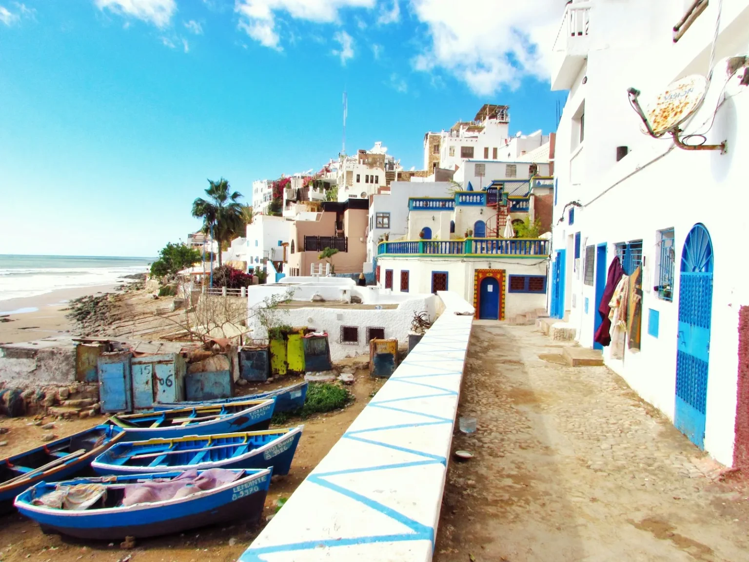 Morocco first visit places - boatd docked near houses and body