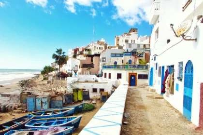 Morocco first visit places - boatd docked near houses and body