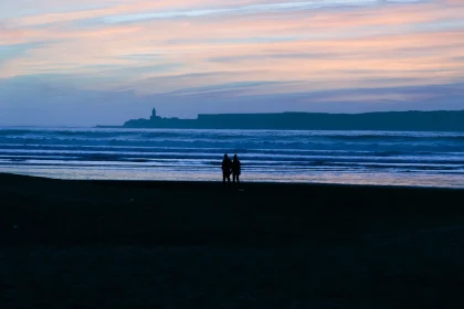 Morocco romantic escapes couples - A couple stands silhouetted on a