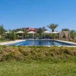 Luxury hotels Morocco - Serene poolside scene in Ouarzazate Lake
