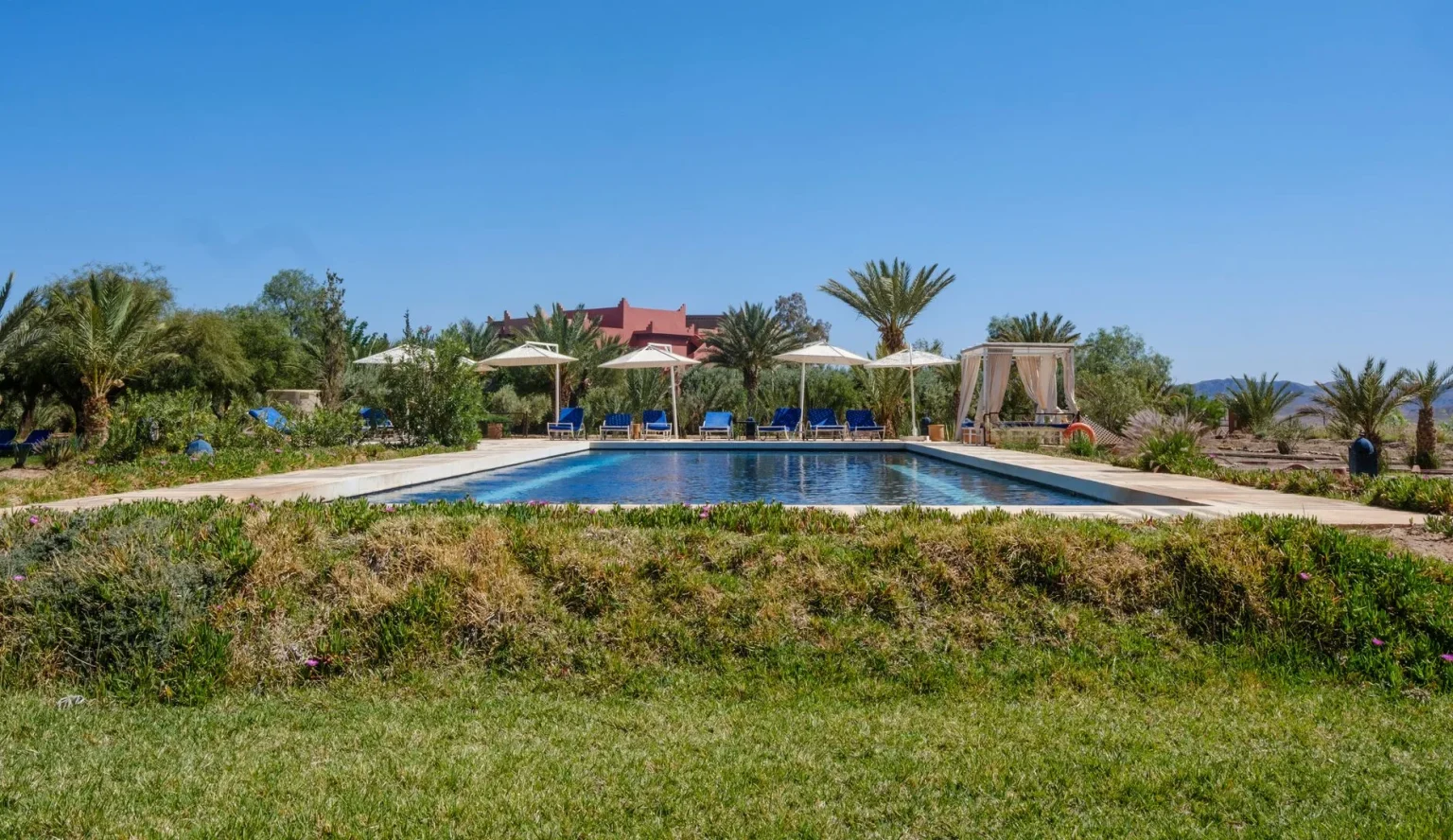 Luxury hotels Morocco - Serene poolside scene in Ouarzazate Lake