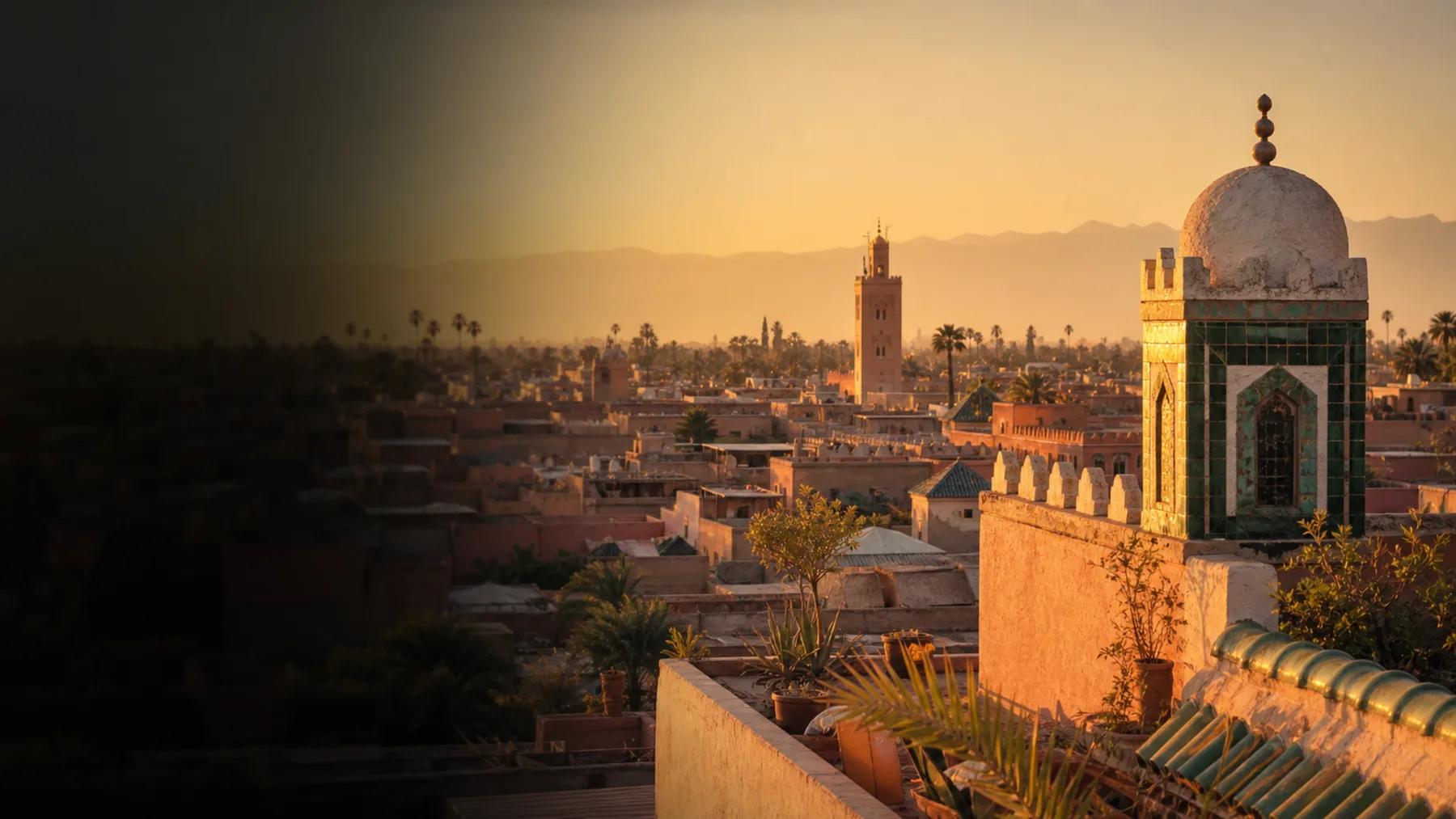 Marrakech rooftop at golden hour with Atlas Mountains in the distance